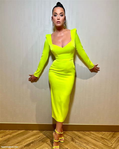 The singer shared a photo of herself on Instagram wearing a neon orange, see-through, cut-out dress that put her toned abs and legs on full display. Katy loves doing hot yoga, and specifically ...